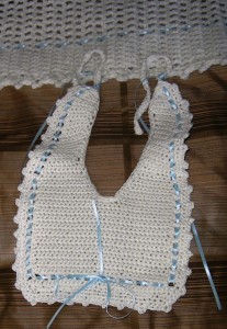 CROCHET BIB WITH BLUE RIBBON